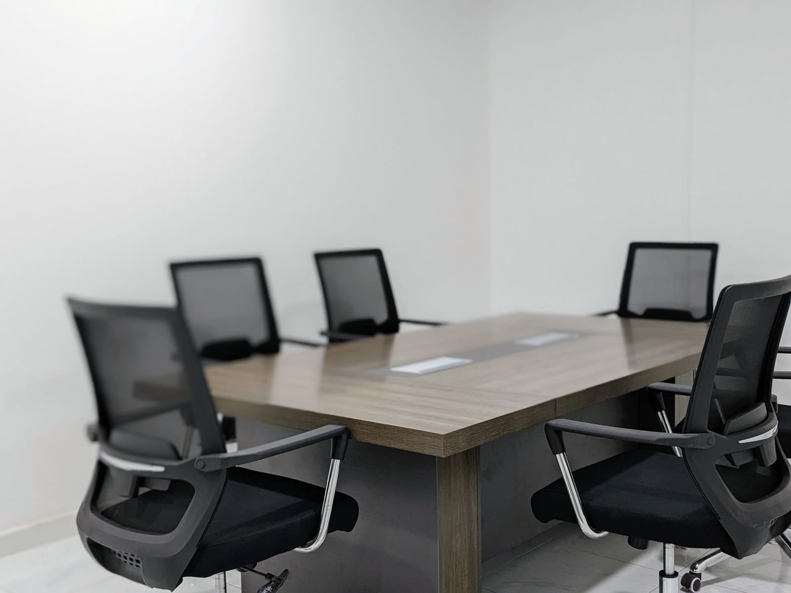 Empty meeting room with a table and chairs