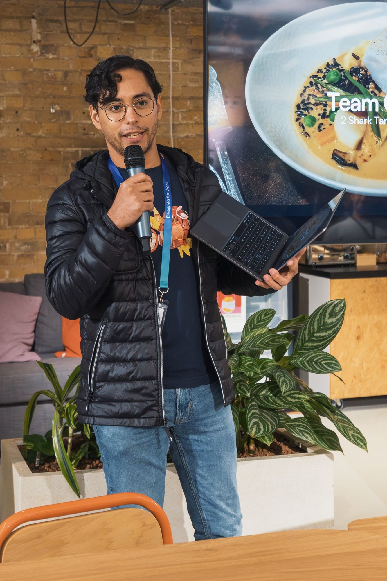 Speaker with a microphone giving a presentation
