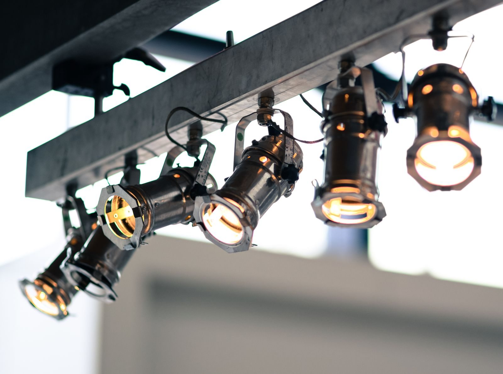 Several directional spotlights mounted overhead