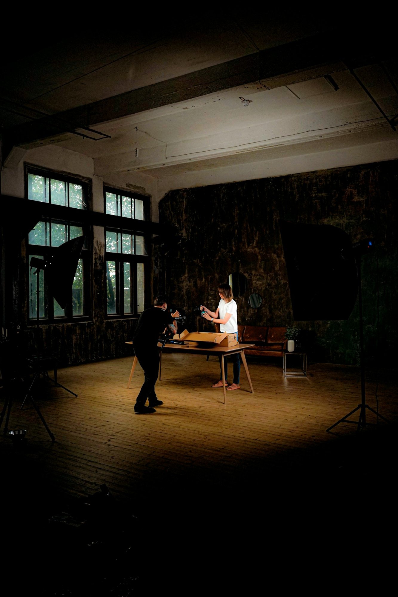 People setting up an indoor product photograph