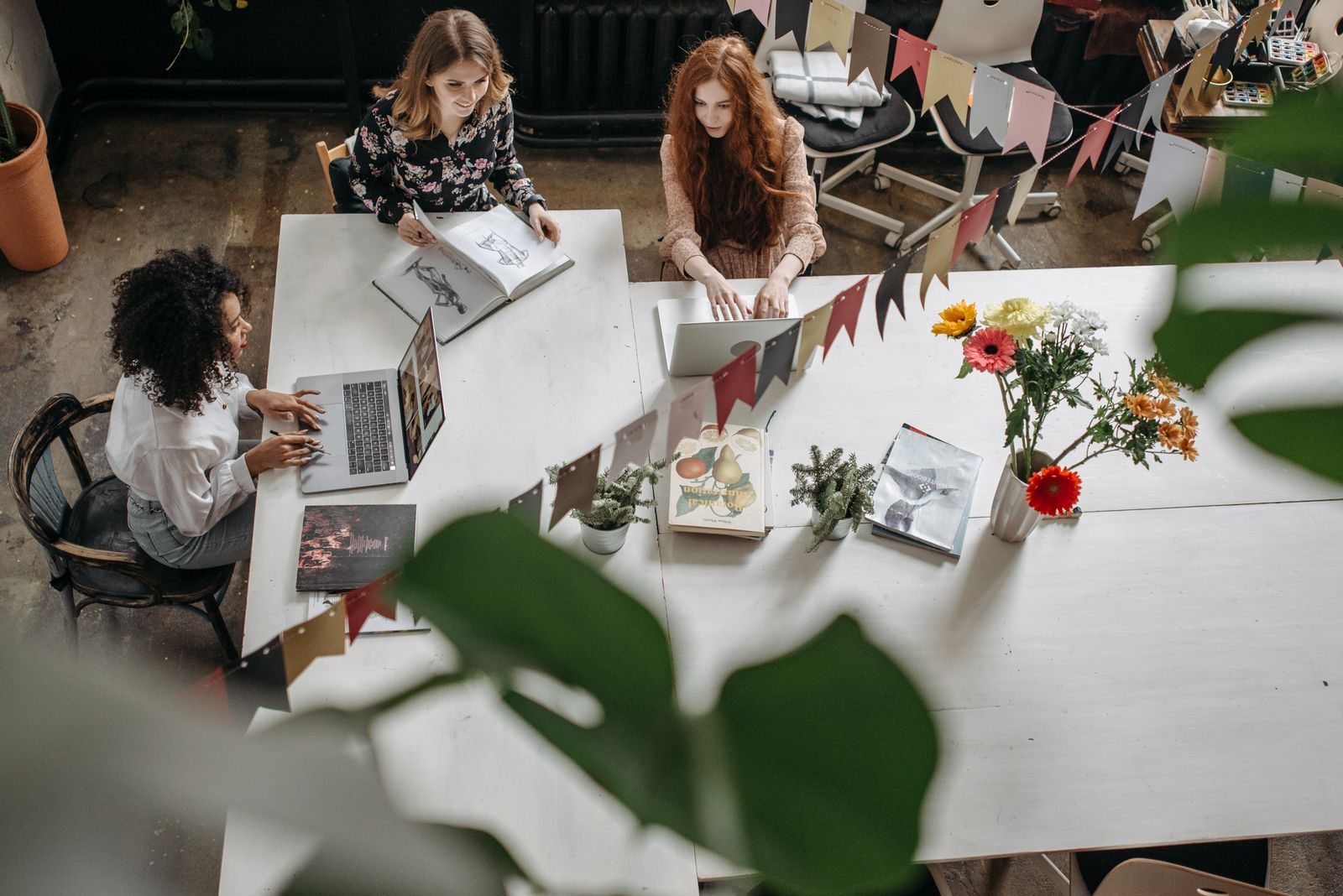 Colleagues working together at a large table
