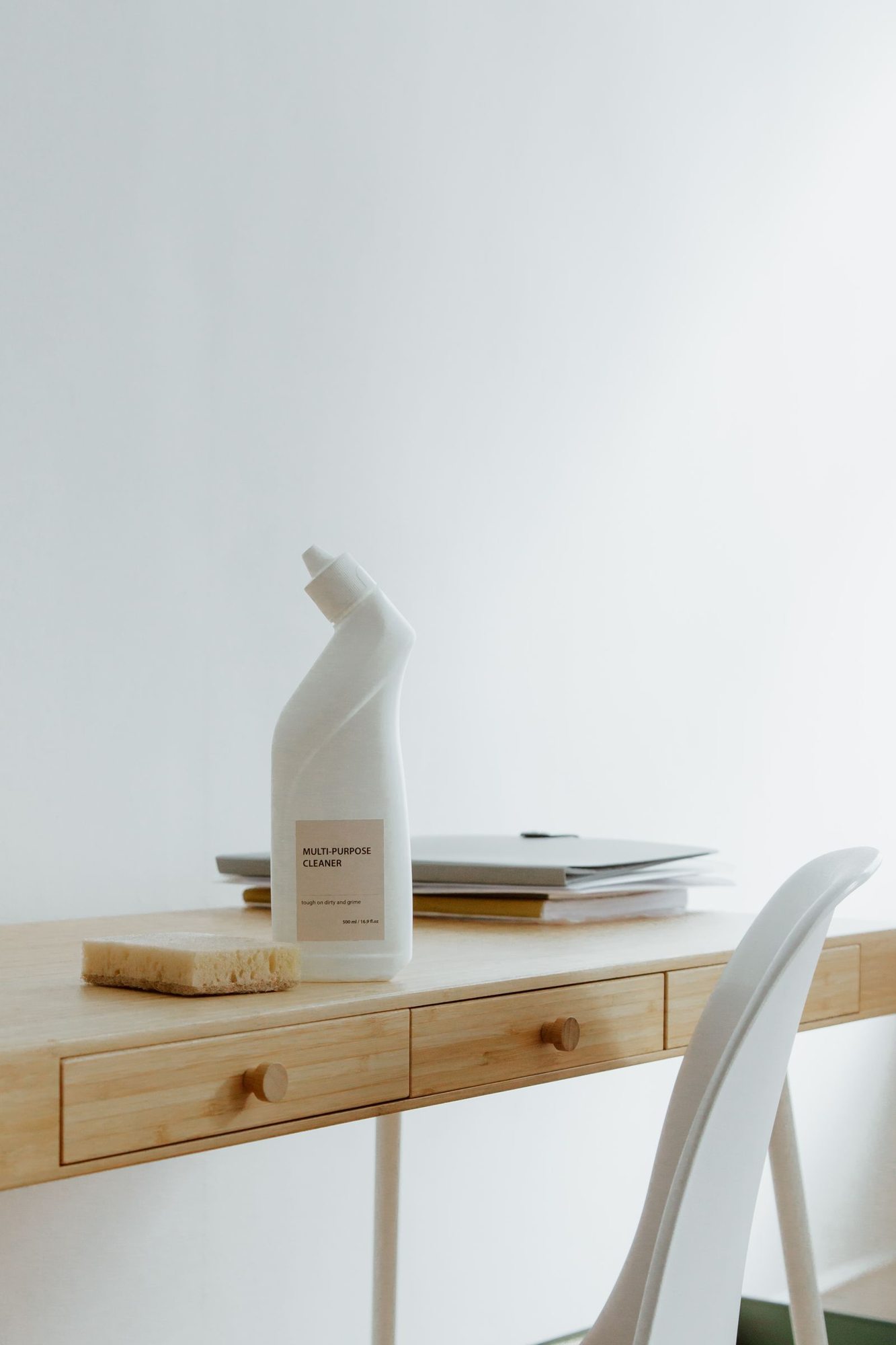 Tidy desk with cleaning supplies