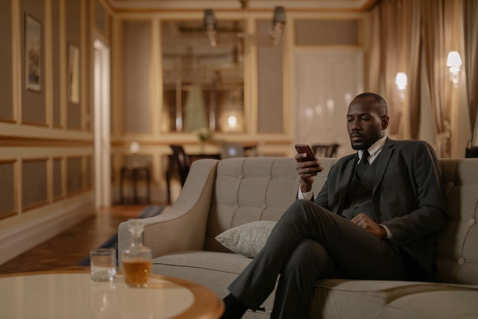 Business traveler using a smartphone in a lounge