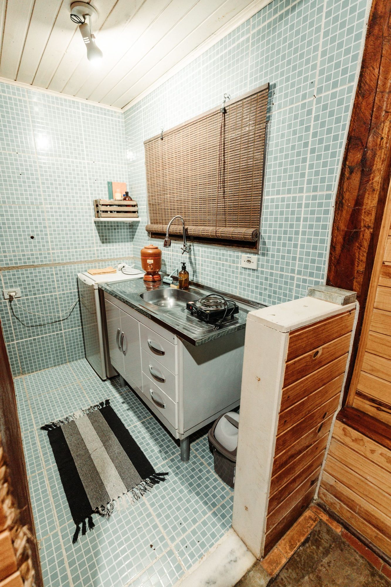 Small apartment kitchen with a sink and worktop