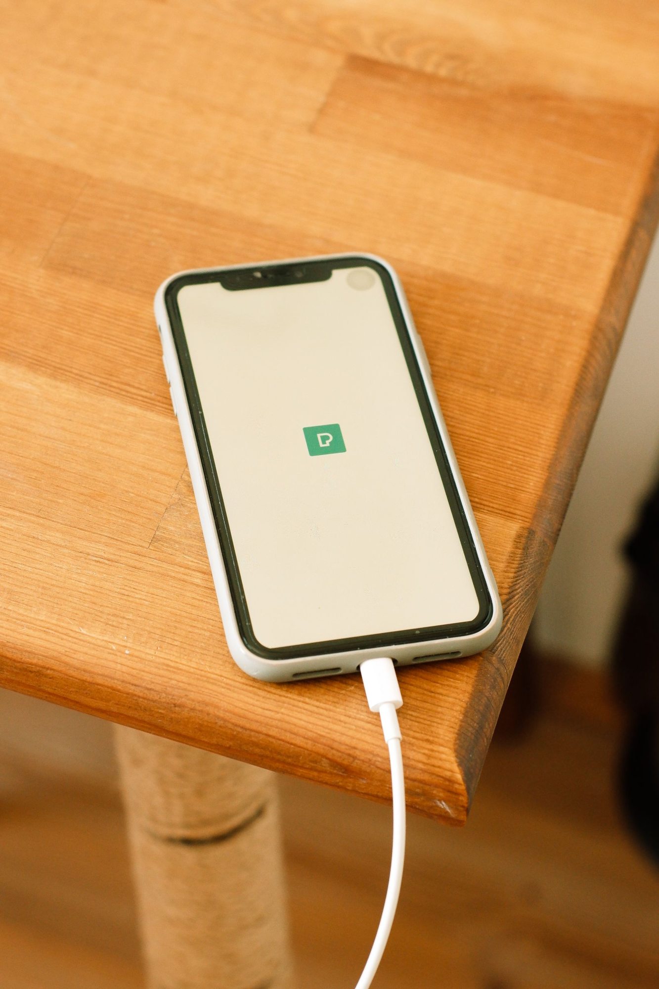 Smartphone charging on a table
