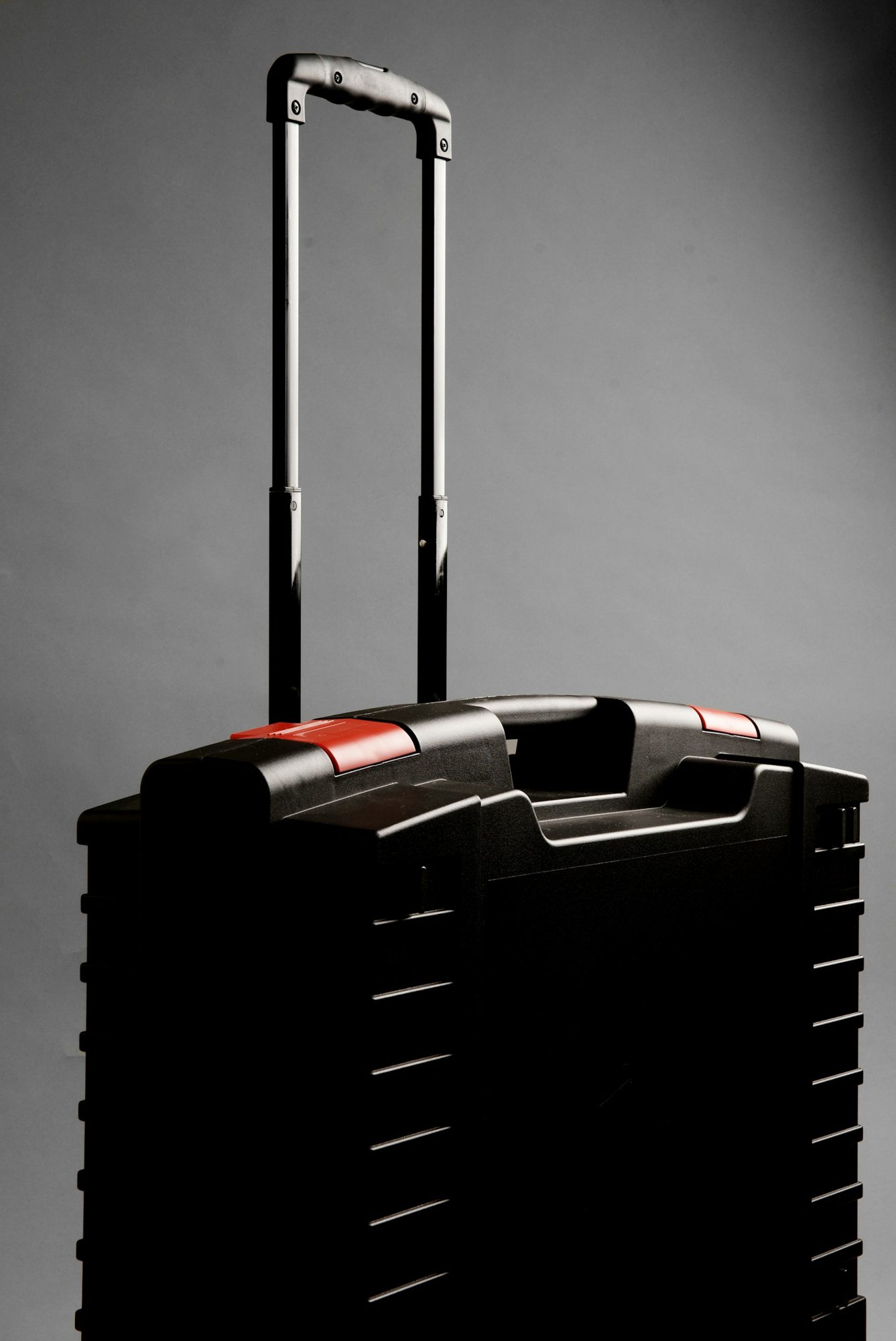 Rolling suitcase with an extended telescopic handle
