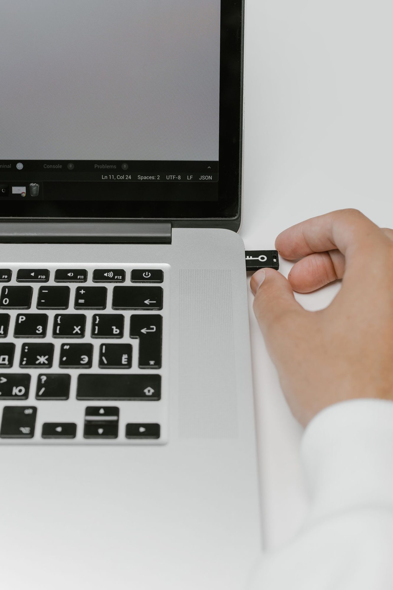 USB flash drive being connected to a laptop
