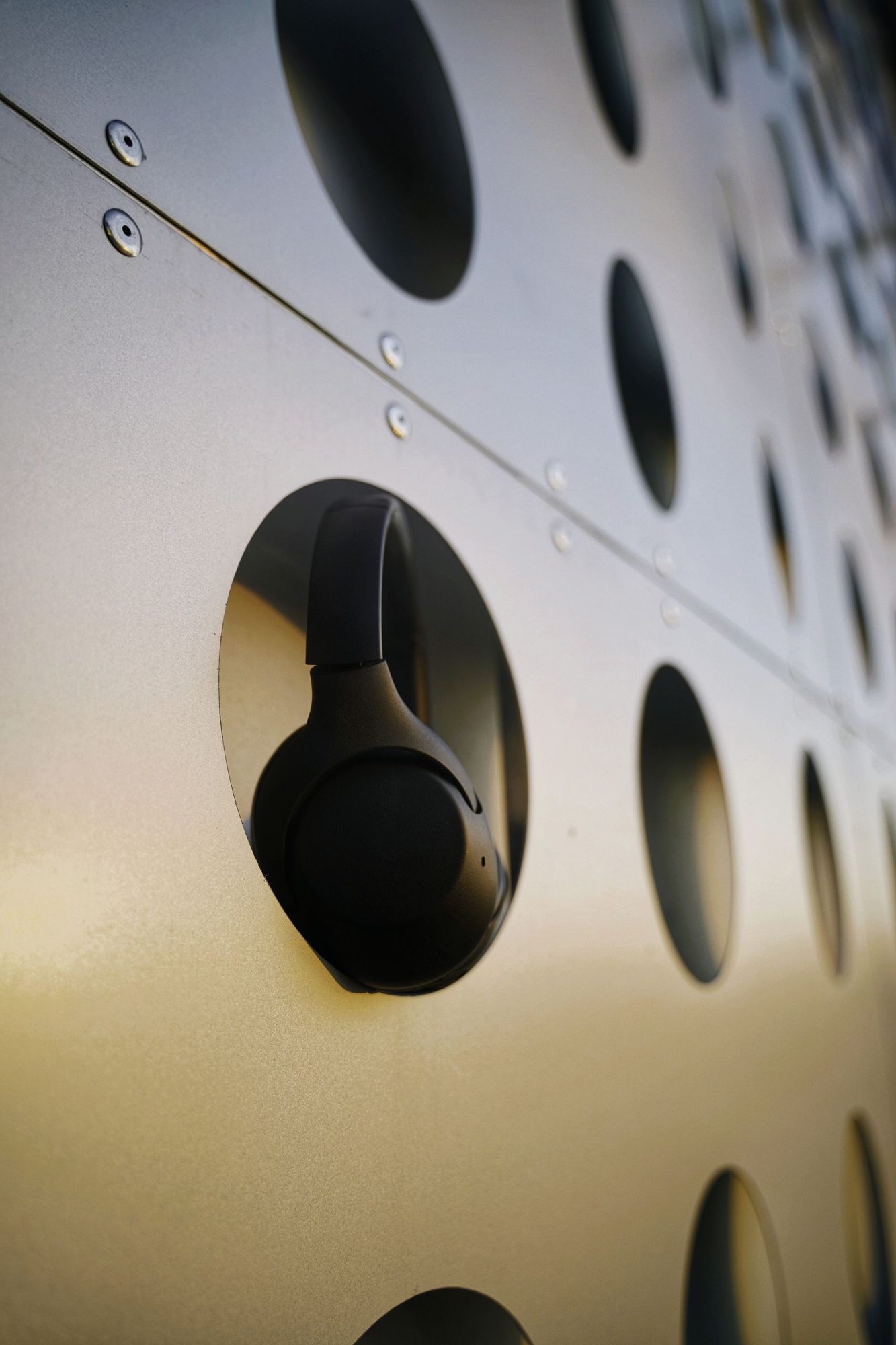 Black headphones against a textured surface