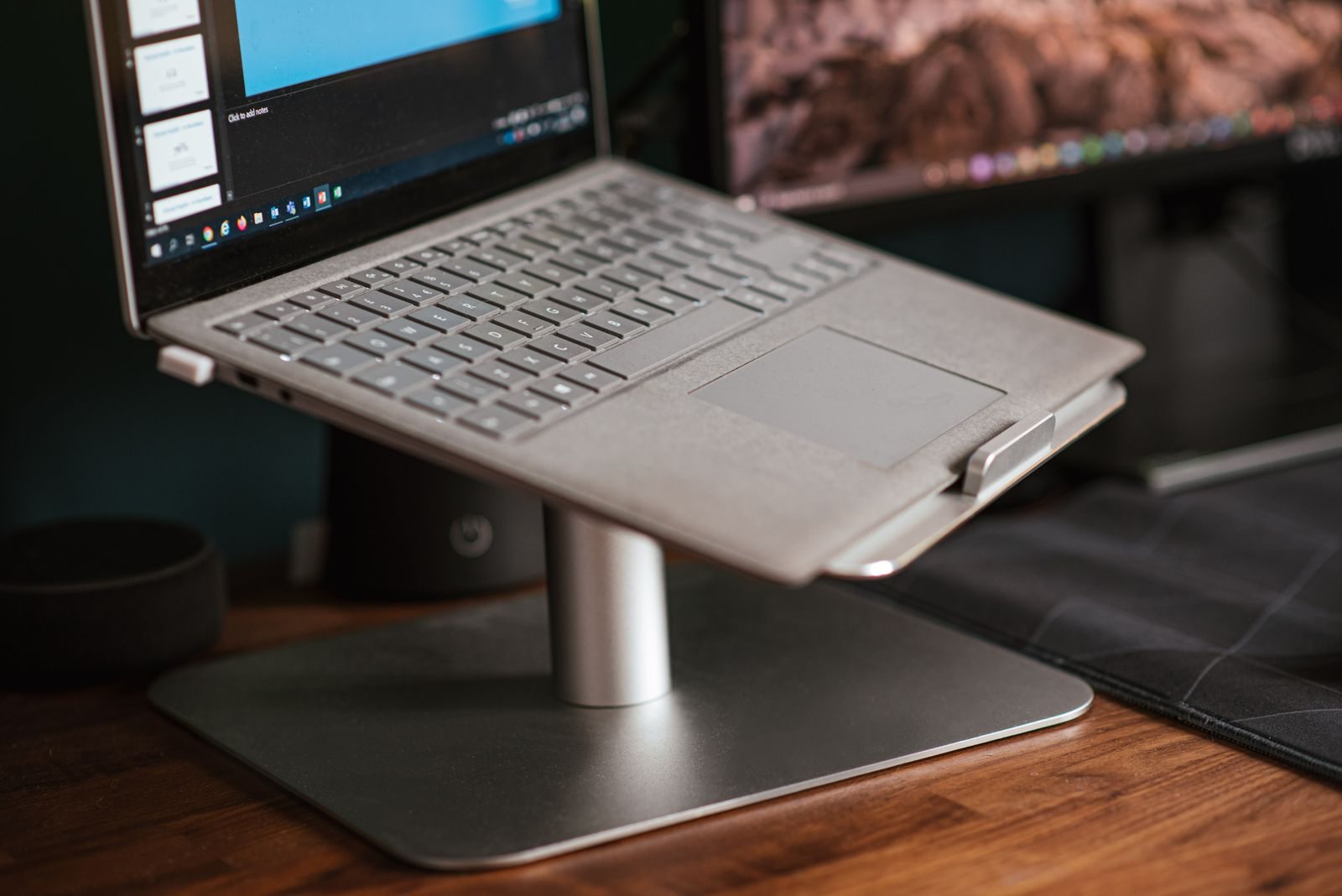 Laptop on a raised desk stand
