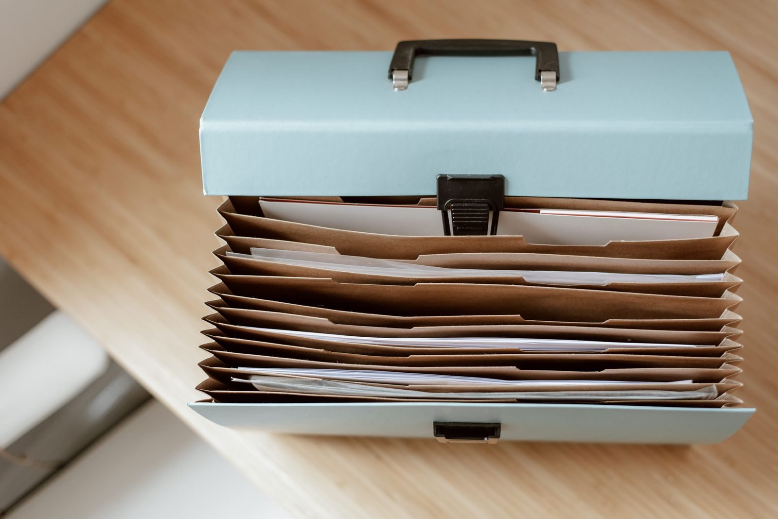Open expanding folder holding documents