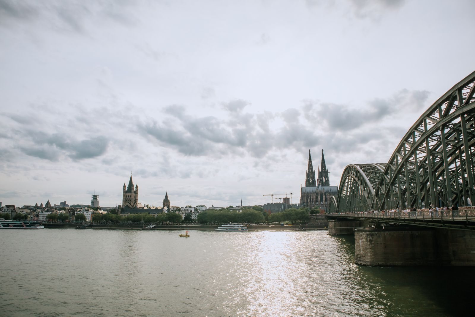Cologne Cathedral and Hohenzollern Bridge beside the Rhine