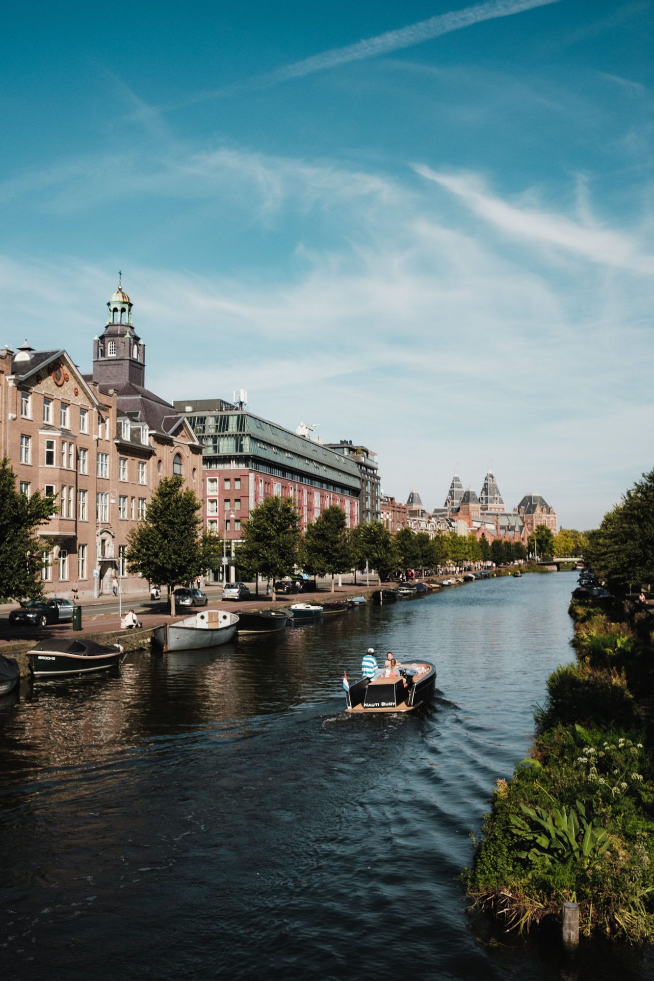 Amsterdam canal lined with houses and boats